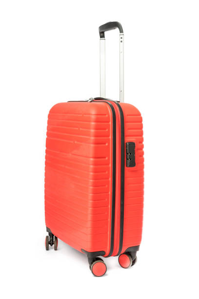 Travel red suitcase isolated on white background.
