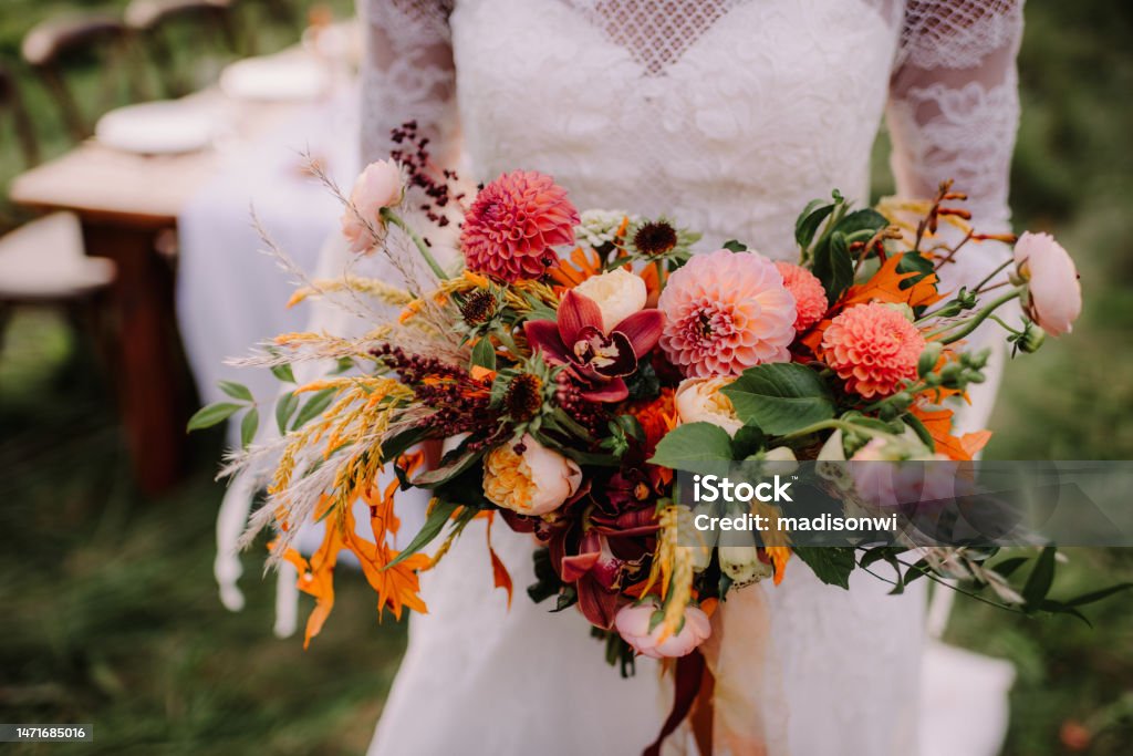 Close up of vibrant wedding bouquet Bride holding a brightly colored floral bouquet Wedding Stock Photo