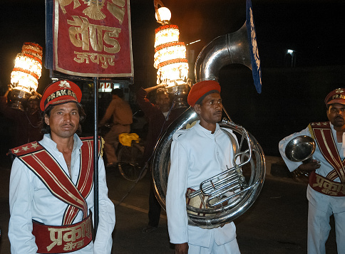 Jaipur, Rajasthan, India - February 21, 2006: Music band at a wedding night parade through the streets of the city