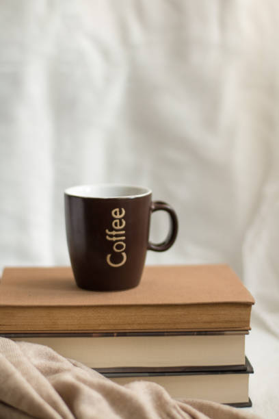istock Simple composition of indoor relaxation with coffee and books. 1471686973