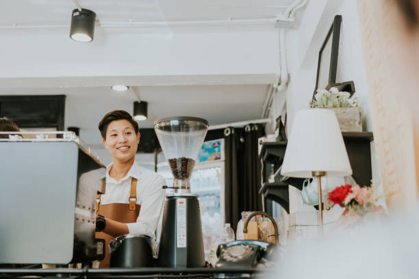 istock Happy asian barista doing an order with love. 1471688972
