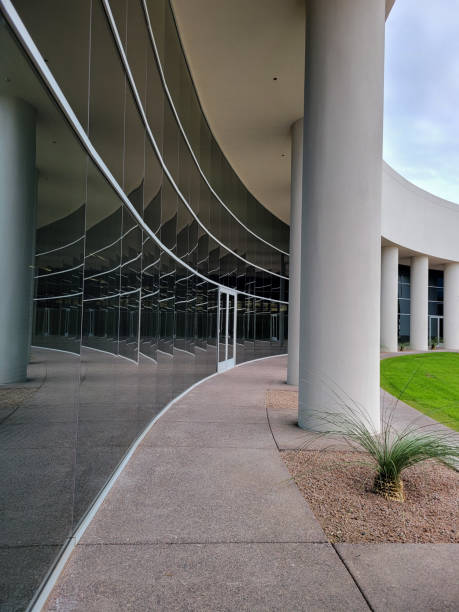 istock Architecture Details Reflection in Curved Mirrror-like Glass Wall 1471689009