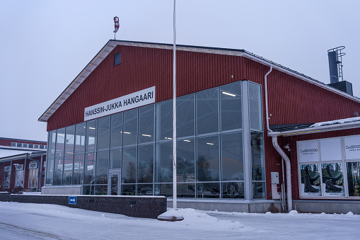 Hangar for Douglas DC-2 airplane Hanssin Jukka in Tuulonen shopping center. Hameenlinna, Finland. February 23, 2023.