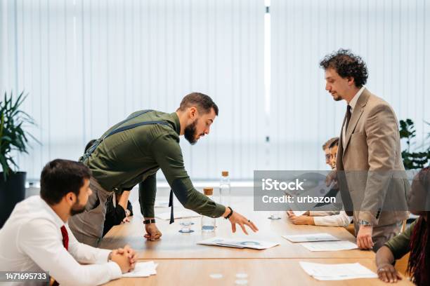 Young Businessman Getting Angry At His Employees At The Office Meeting Stock Photo - Download Image Now