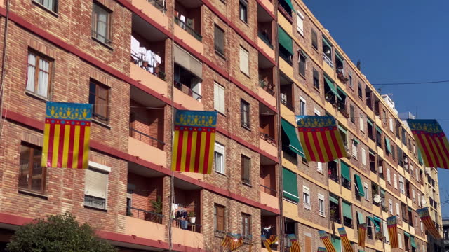 Garland of Valencian flags hanging in the street