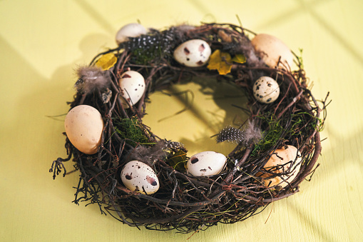 Easter Decoration with Easter Wreath and Eggs on Vibrant Background