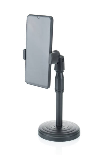 istock Smartphone on black tripod with blank screen isolated on white background 1471699027