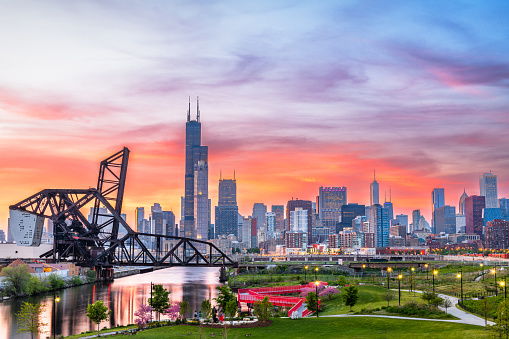 Chicago, Illinois, USA park and downtown skyline at twilight in spring.