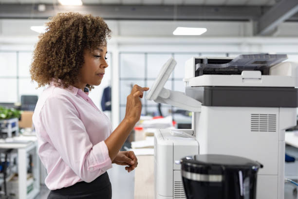 istock Business woman working at the office and copying a document 1471700504