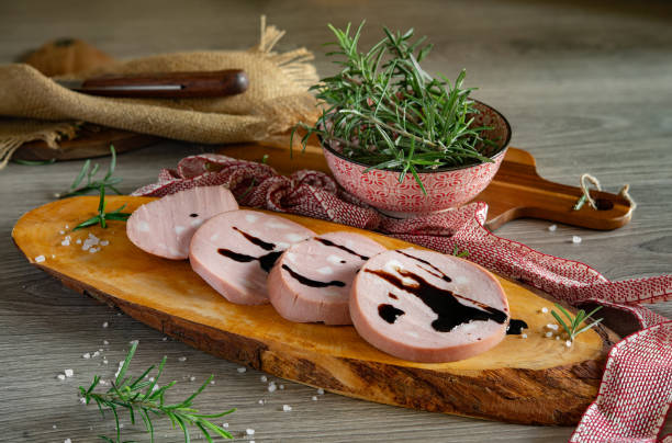 slices of bologna pgi mortadella on wooden cutting board - vinegar balsamic vinegar modena italy imagens e fotografias de stock