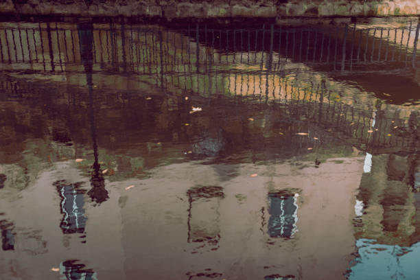reflection of an old building in the city river