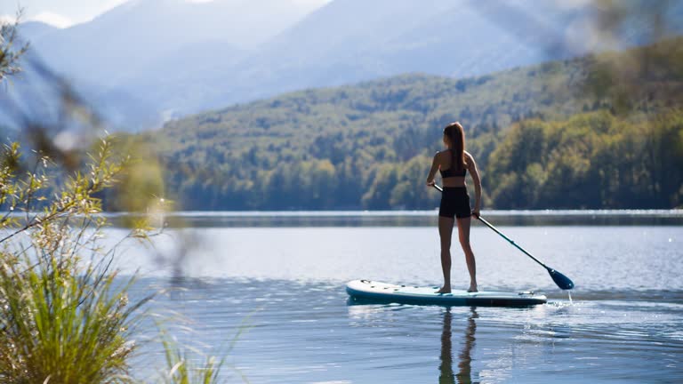 Enjoying a peaceful escape on a beautiful lake on a stand-up paddle