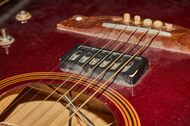 istock Vintage guitar in the dust close up. 1471702534