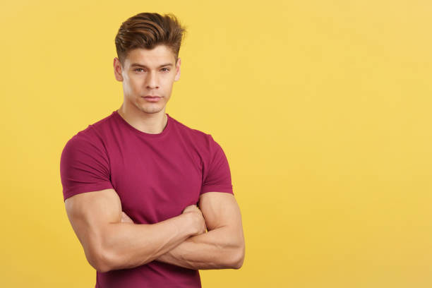 istock Serious man looking at camera with arms crossed 1471703496
