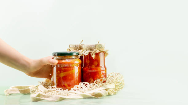 istock Woman hand holds pickled or fermented vegetable 1471703809