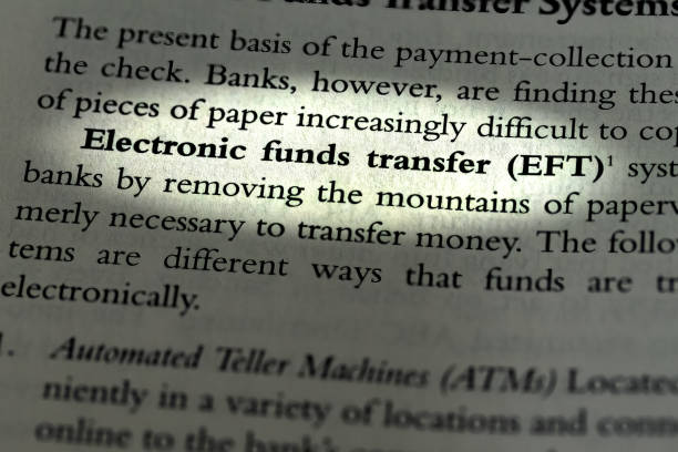istock EFT Electronic Funds transfer highlighted and written in business law textbook 1471705448