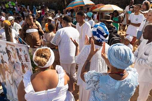 Salvador, Bahia, Brazil - February 02, 2023: Candomble members are seen paying homage to Yemanja during the Rio Vermelho beach party in Salvador, Bahia.