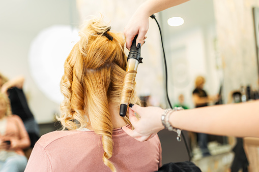Blonde woman on hairdresser appointment