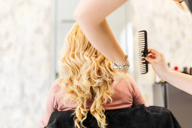 istock Hairdresser using comb 1471707880