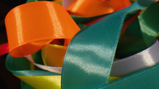 Colorful silk twisted bright ribbons - close up