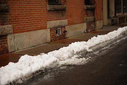 Snowstorm in the city street displaying large amount of snow depicting a cold winter