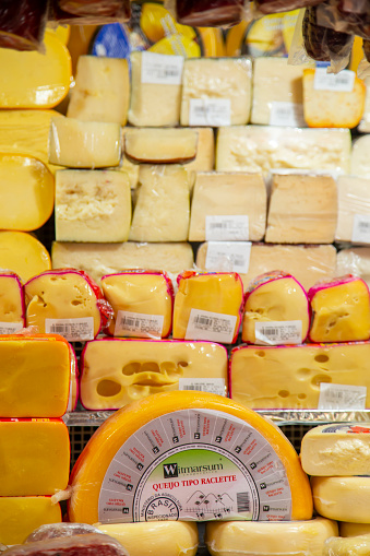 Sao Paulo, Sao Paulo, Brazil – November, 15, 2015: variety of cheese for sale at Sao Paulo's municipal market. No people.