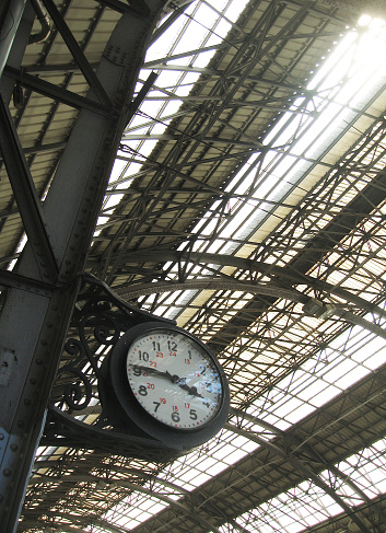 Old train station clock In Portbou, Catalonia, Spain.