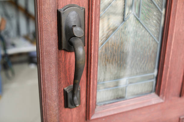 istock Metallic door handle in modern door also showing keyhole symbolizing security at home and office 1471715911