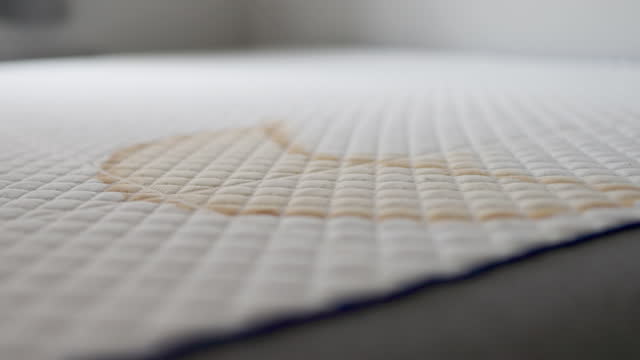 Stained bed mattress, before professional cleaning. Slow motion video.