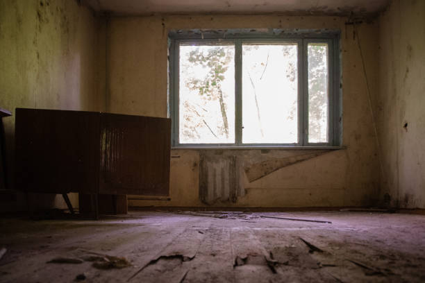 istock Rusty windows with broken glasses viewed from inside an abandonated house located at chernobyl radioactive exclusion zone 1471722604