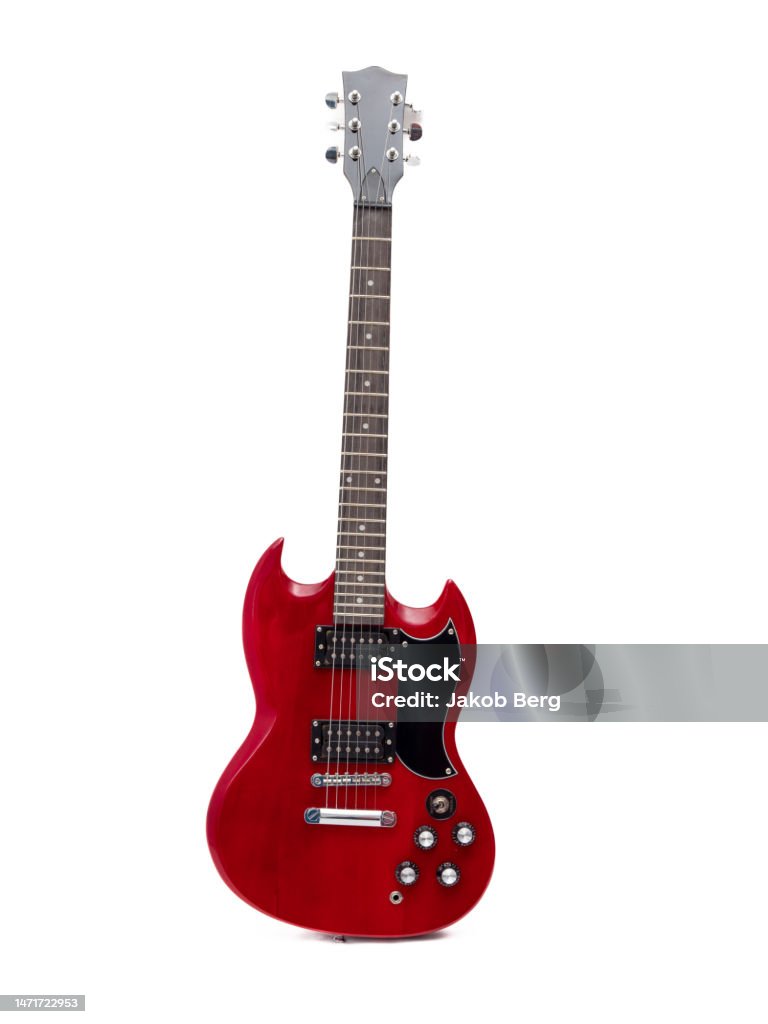 Red electric guitar isolated on white background. Musical instrument guitar. Red electric guitar isolated on white background. Musical instrument guitar. Close-up. Electric Guitar Stock Photo