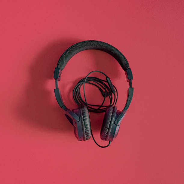 istock Black headphones on red background. Top view image. 1471726570