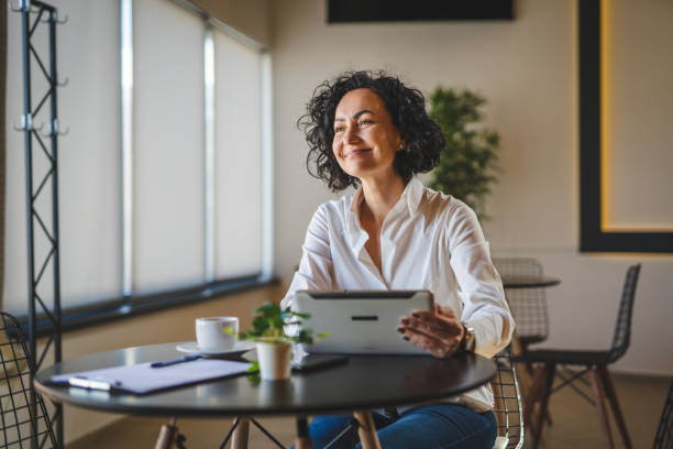 istock One woman mature female entrepreneur use digital tablet for work 1471727323
