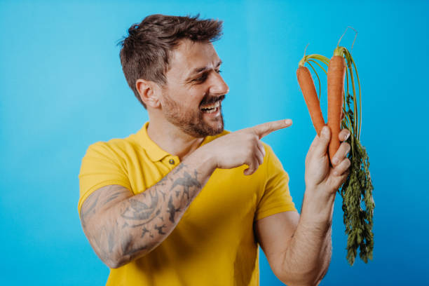Man holding vegetable stock photo