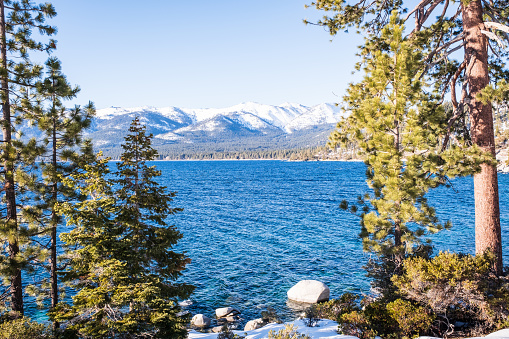 Views of Lake Tahoe from along the Tahoe East Shore Trail, part of the Lake Tahoe Nevada State Park during a snowy February.