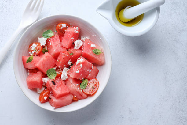 istock Watermelon salad with cheese served on plate 1471731408