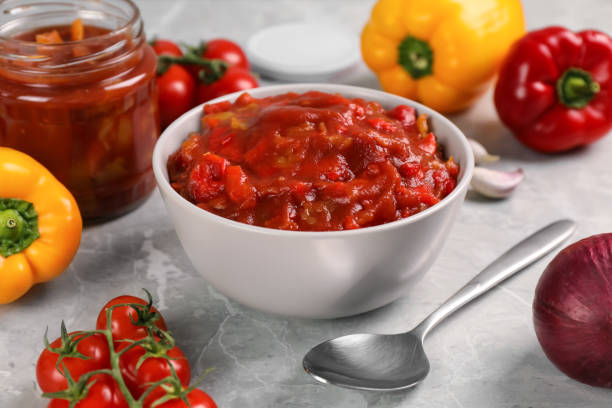 istock Delicious lecho and fresh ingredients on light grey marble table, closeup 1471733308