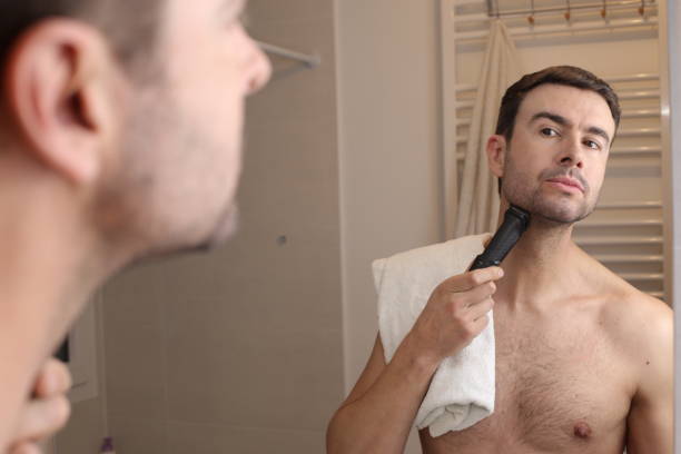 istock Man shaving in front of the mirror 1471733347