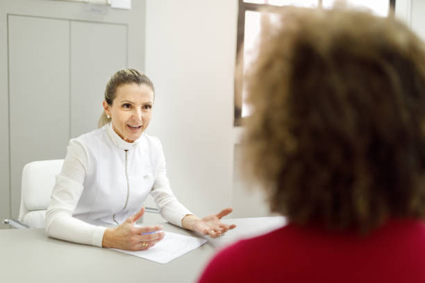 istock Beautician talking with her client about cosmetic procedures 1471734093