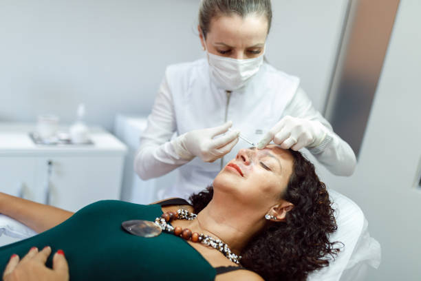 istock Botox being applied on a woman's nose bridge 1471734269