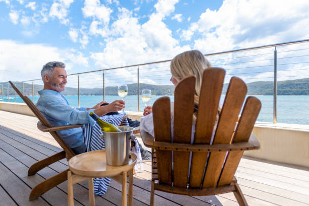 istock Mature couple drinking wine out on the deck. 1471735798