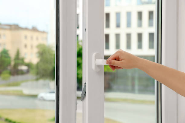istock Woman opening white plastic window at home, closeup 1471737058