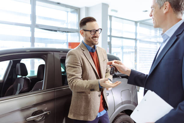 istock Man buying a new car 1471738825