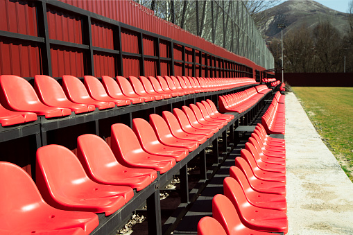 Red chairs in the football stadium