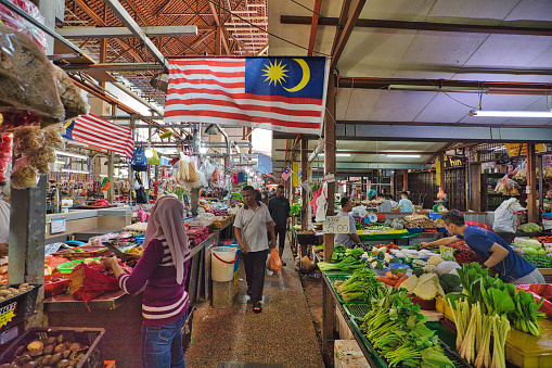 Kuala Lumpur, Malaysia - Jan 2023: in Chow Kit Market Vendors known for friendly and engaging personalities are often happy to share their knowledge of local produce and cooking tips with customers
