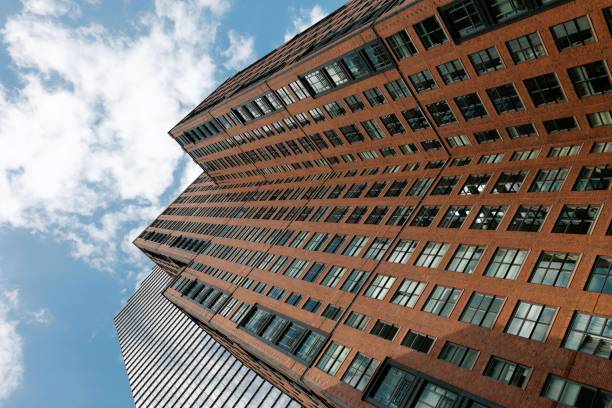 istock Modern architecture looking straight up to sky from below 1471749404