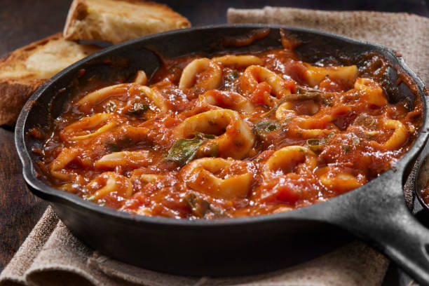 Italian Style Calamari in Tomato Sauce stock photo