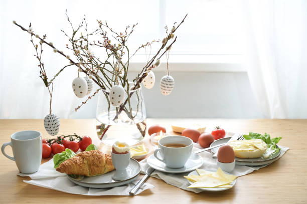 istock Breakfast or brunch with Easter egg decoration on a wooden dining table, place setting on a spring holiday, copy space, selected focus, narrow depth of field 1471751795