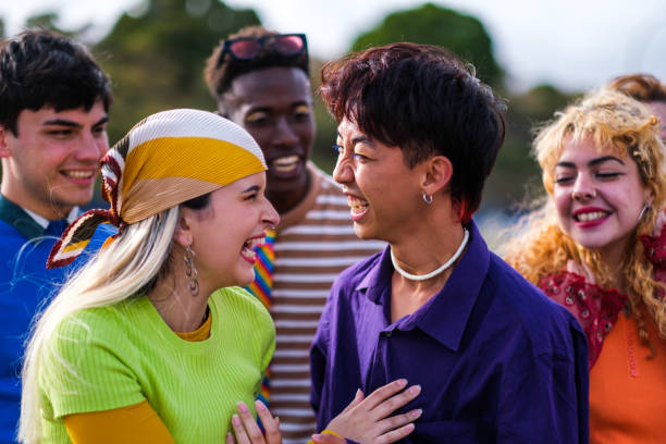 istock Group of diverse teenagers with makeup having a fun time outdoors. Concept: Pride, multicolor, lifestyle 1471752021
