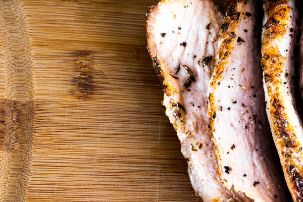 istock Pork steak roasted on a wooden board and sliced. 1471752793